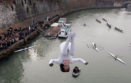 Orlando Duque of Colombia dives into the Tiber River from one of Rome's many bridges as part of traditional New Year celebrations January 1, 2007. Seven men sprinkled the muddy water of the Tiber, taking the plunge from The Cavour bridge, continuing an annual tradition which dates back to 1946.