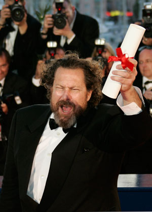 U.S. director Julian Schnabel holds the Best Director prize for his film 