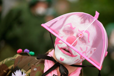 A member of the German Clown Army protests during an anti-G8 summit demonstration in Kuehlungsborn June 5, 2007. The Clandestine Insurgent Rebel Clown Army is a UK-based anti-authoritarian activist group that uses non-violent actions to challenge corporate globalisation, war and actions that the group opposes. 