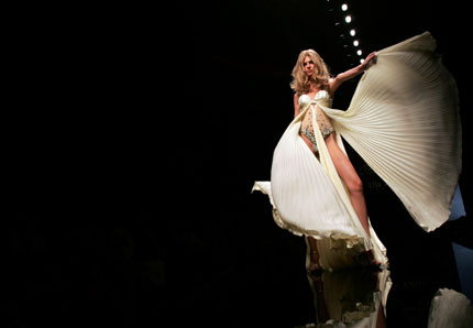 A model displays creation from Lebanese fashion designer Ella Zahlan's autumn/winter collection in Rome during Rome Fashion Week July 12, 2007.