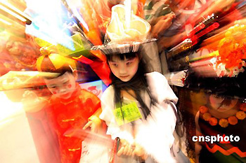 Children wear scary costumes to celebrate the forthcoming Halloween Festival in Hong Kong on Tuesday, Oct. 24, 2006. Halloween is celebrated on the night of Oct. 31.