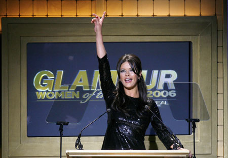 Actress Catherine Zeta Jones gestures while introducing Queen Latifah during the 2006 Glamour Magazine 