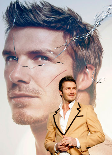 Soccer player David Beckham of England leaves after a promotional event in Tokyo December 29, 2006. 