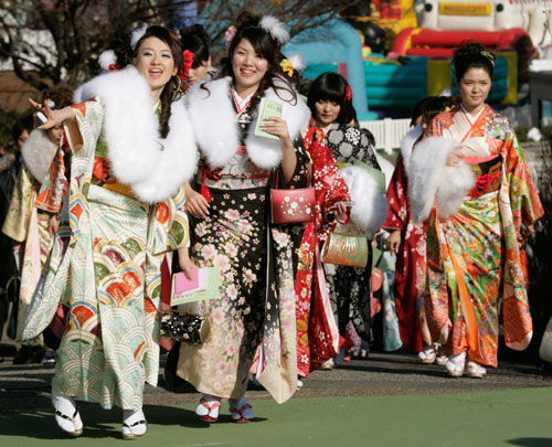 Women in kimonos attend a ceremony celebrating their Coming of Age Day at Toshimaen amusement park in Tokyo January 8, 2007.