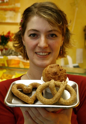 'Dog's Goodies' shop owner Janine Saraniti-Lagerin presents a selection of dog biscuits in her dogs-only bakery in the western German city of Wiesbaden January 8, 2007. 