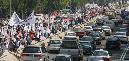 Thousand of women and members of social organizations take part in a march to mark International Women's Day in Mexico City March 8, 2007. (Reuters)