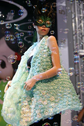 A model parades an outfit made of condoms during a fashion show at the 4th China Reproductive Health New Technologies & Products Expo in Beijing July 11, 2007. Condoms of all shapes and sizes were on show at a Beijing fashion show on Wednesday featuring dresses, hats and even lollipops made of the said item.