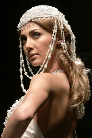 A model displays a creation from Lebanese fashion designer Ella Zahlan's autumn/winter collection in Rome during Rome Fashion Week July 12, 2007.