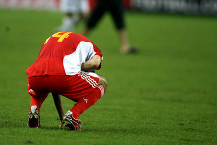 Chinese player Zhu Ting is seen after the team's 0-3 defeat to Uzbekistan during their 2007 AFC Asian Cup Group C soccer match in Shah Alam outside Kuala Lumpur July 18, 2007.