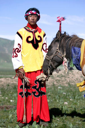 Tibetan sisters in traditional costume walk on a street in Yushu, west China's Qinghai province, July 26, 2007.