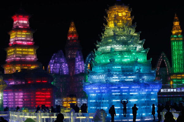 Ice sculptures shine at night in Harbin