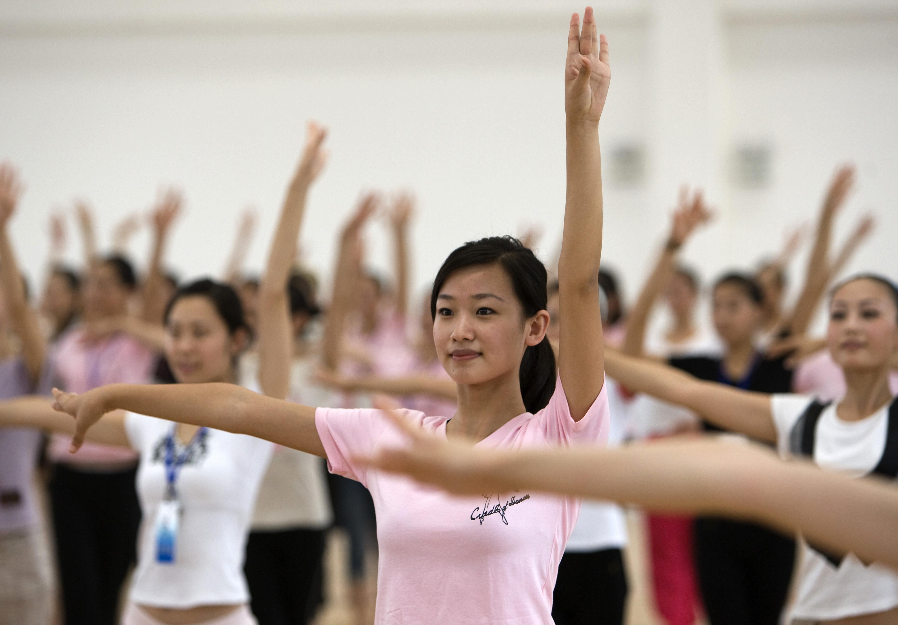 Olympic medal ceremony hostesses train for the coming Games