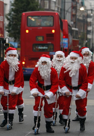 Santa Claus on skate scooter to promote shopping