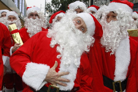 Santa Claus on skate scooter to promote shopping