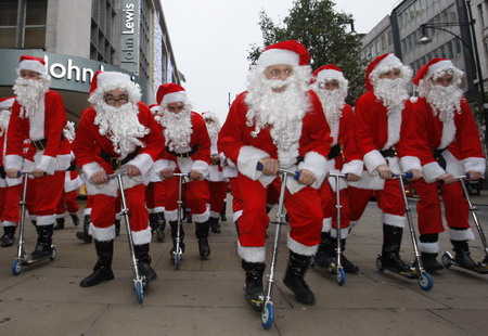 Santa Claus on skate scooter to promote shopping