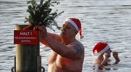 Santas go for ice swimming