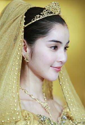 Gold thread made wedding dresses displayed in Japan