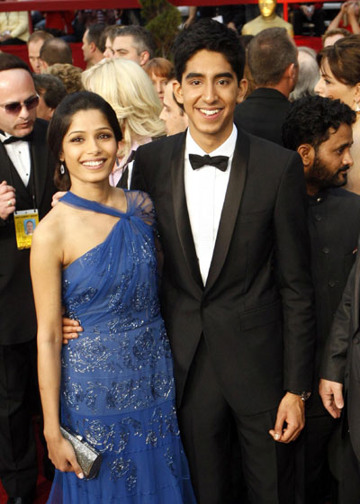 `Slumdog' rules Oscars with 8 prizes