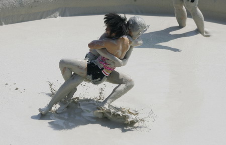 Mud and guts in women's mud wrestling contest