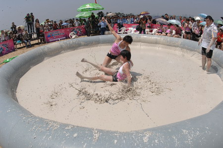 Mud and guts in women's mud wrestling contest