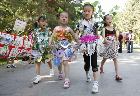 Nursery pupils on green catwalk show