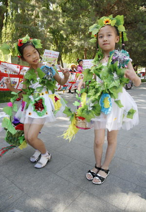 Nursery pupils on green catwalk show