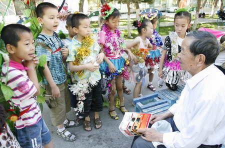 Nursery pupils on green catwalk show