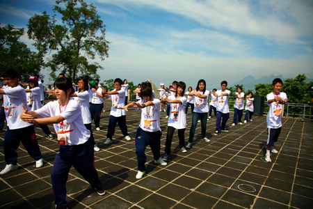 Students practice Tai Chi on the Great Wall