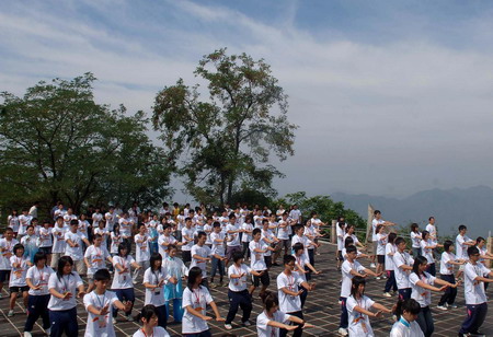 Students practice Tai Chi on the Great Wall