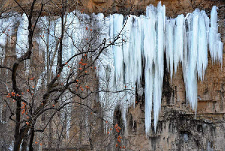 Grand ice fall on mountain cliffs in N China