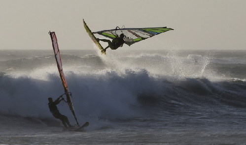 Windsurfers taking on waves in Cape Town