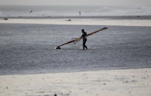 Windsurfers taking on waves in Cape Town